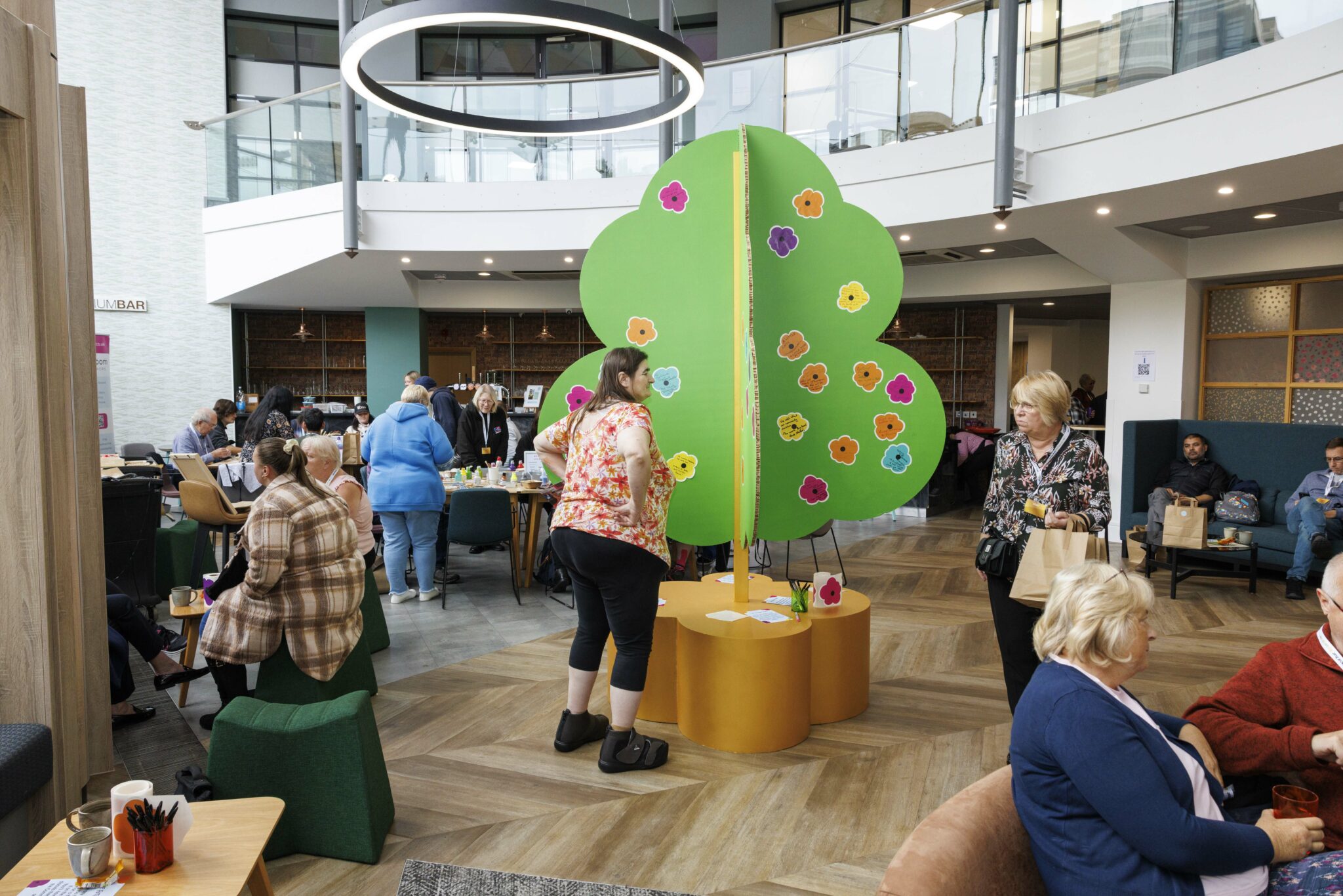 Filwood Fantastic and community residents standing outside their community centre and smiling