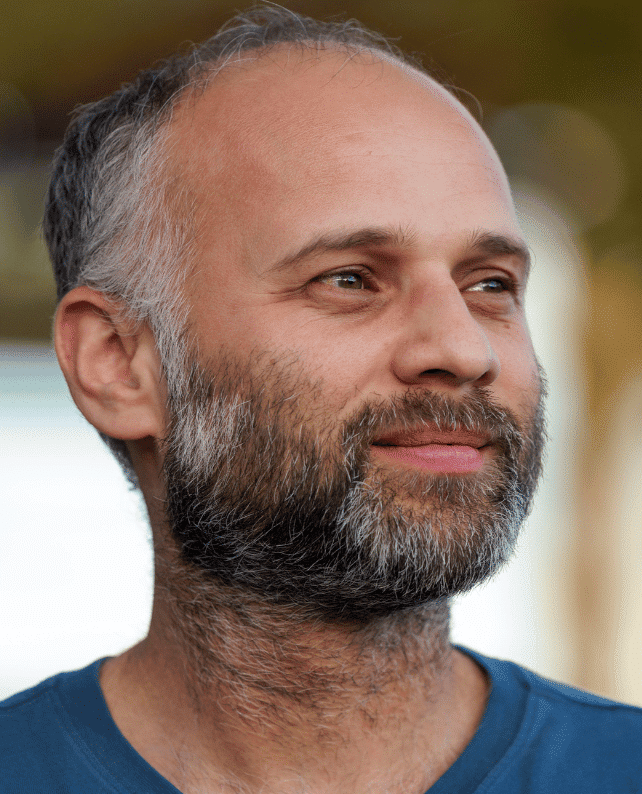 Portrait image of Waqas smiling