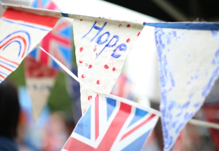 A string of blue, white and red bunting, including the union jack and the word 'Hope'.